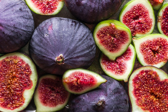 Background of figs. Fresh, juicy ripe fig fruits slices.