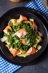 pappardelle pasta with creamed spinach and fried salmon