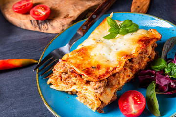spicy lasagne with tomato sauce and basil