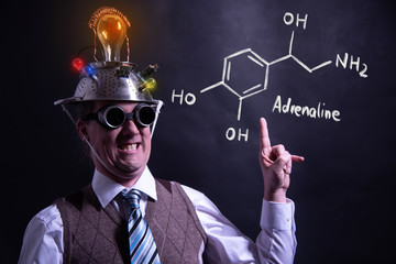 Nerd presenting handdrawn chemical formula of adrenaline