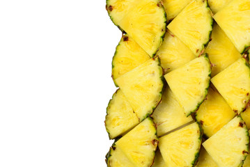 Pineapple juicy yellow slices background. Top view.