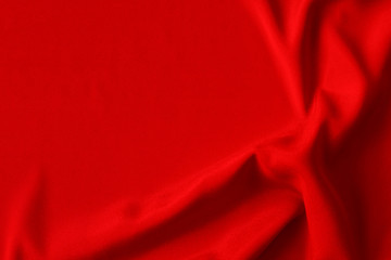 Red silk or satin luxury fabric texture can use as abstract background. Top view