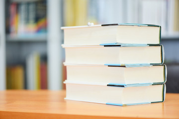 Education concept back to school and study - book in library with book stacked on the table with pencil