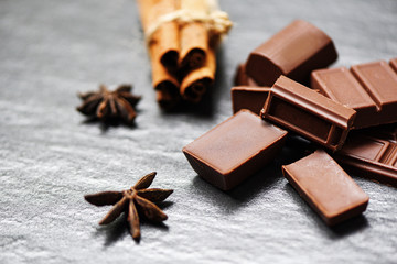 Chocolate bar and spice on dark background candy sweet dessert for snack