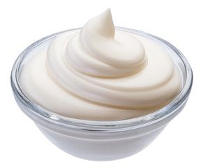 Mayonnaise swirl in glass bowl. Clipping path.