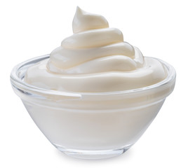 Mayonnaise swirl in glass bowl. Clipping path.