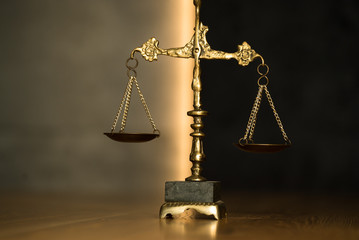 Law and Justice, judge gavel with scales on wooden table.