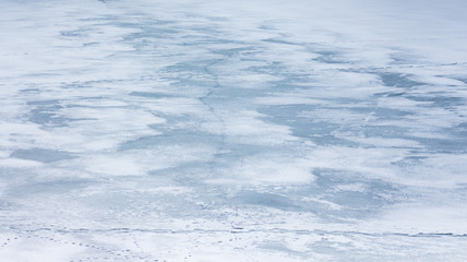Texture of ice covered with snow. Winter background_