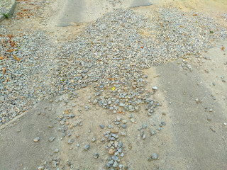 A gray road with stones