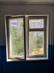 The window in the house is white with walls white