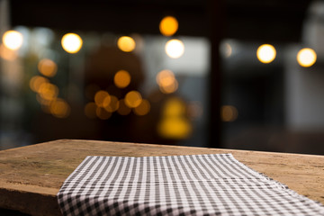 Empty wood table top on blur light gold bokeh of cafe restaurant in dark background - 287895211