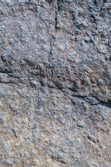 Stone for the background. Cracks. Vertical layout.