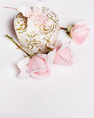 Pink rose with gift box on white background