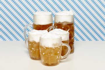 Blonde beer pints on white table