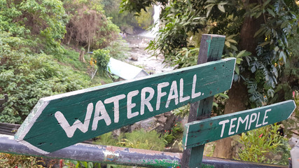 Signs in a fores near the Tegenungan waterfall, Bali, Indonesia