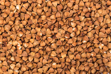 Macro Photo food buckwheat groats. Texture background grain buckwheat groats. Image food product porridge buckwheat grains