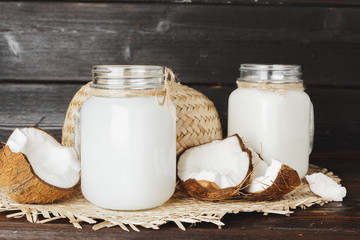 Coconut and glass jug with coconut milk
