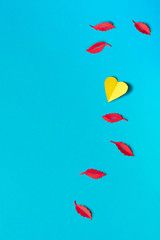 Paper Autumn leaves, flat lay on blue paper background, copy-space