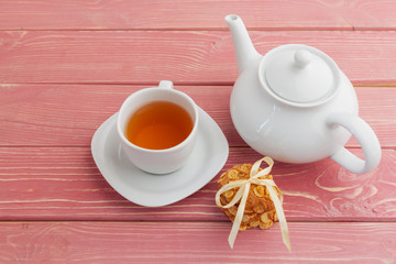 Homemade crunchy cookies and  tea on a wooden table