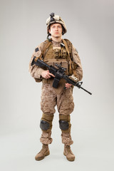 United states Marine Corps special operations command  raider with weapon. Studio shot