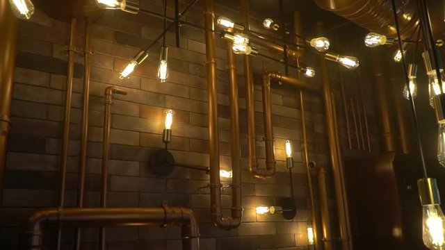 Room with lots of light bulbs and pipes in steampunk style