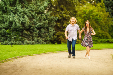 Fototapeta premium Happy couple playing in park