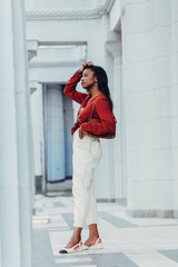 Fototapeta na wymiar Outdoor full fashion portrait of fashionable black woman skin