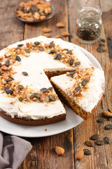 pumpkin cake with spices on wood background