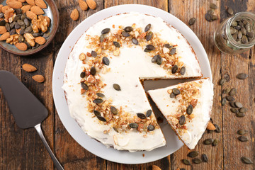 pumpkin cake with spices on wood background