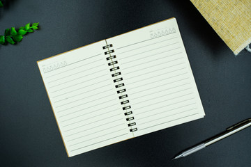 blank notebook on black background