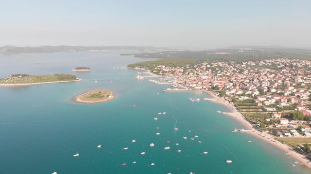 a professional looking aerial of the crystal clear adriatic sea in croatia, flying towards pakostane in higher altitude