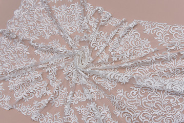 Texture lace fabric. lace on white background studio. thin fabric made of yarn or thread. a...