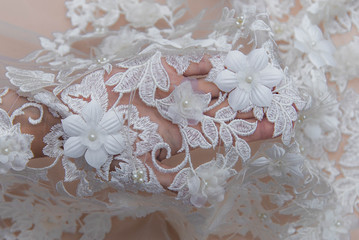 Texture lace fabric. lace on white background studio. thin fabric made of yarn or thread. a...