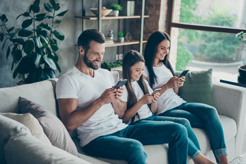 Profile side view of nice attractive cheerful focused family wearing casual white t-shirts jeans...