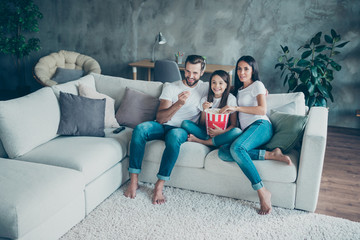Portrait of nice attractive lovely cheerful family mommy daddy wearing casual white t-shirts jeans...