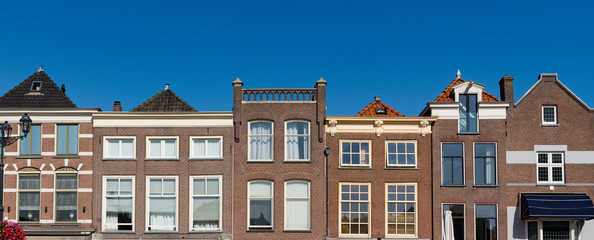 facade of houses on main square Markt in Delft, The Netherlands