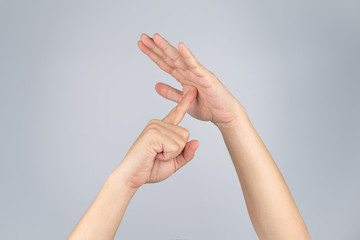 TimeOut sign and simbol from Asian human hand with isolate white background and clipping path.