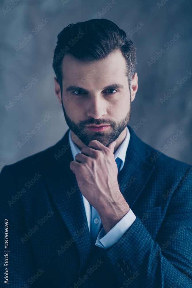 Poster portrait of elegant pensive man touching his chin looking wearing blazer jacket isolated over grey b