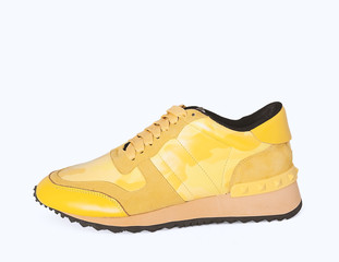 yellow sneakers on yellow background