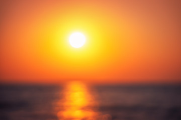Fototapeta na wymiar Defocused background ot beautiful sunrise over the tropical seadefo