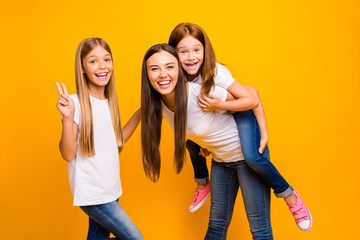 Photo of crazy three ladies showing v-sign playful weekend wear casual clothes isolated yellow background - obrazy, fototapety, plakaty