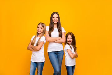 Photo of three sister ladies self-confident crossing arms wear casual outfit isolated yellow background