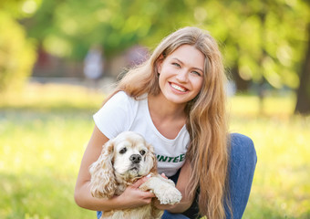 Female volunteer with cute dog outdoors