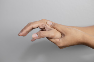 Woman suffering from pain in hand.