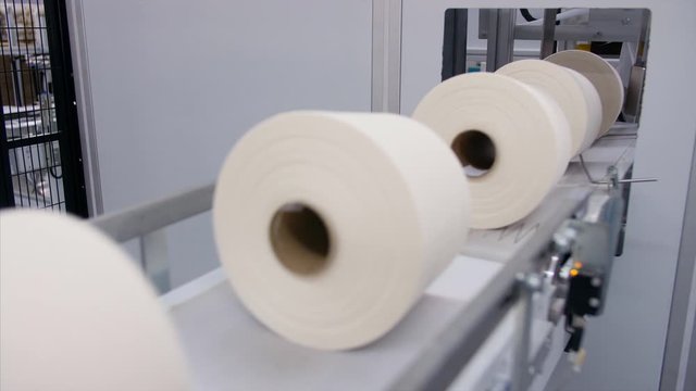 Textile Industry - Closeup shot of the yarn creel spool passing through automatic machine . 