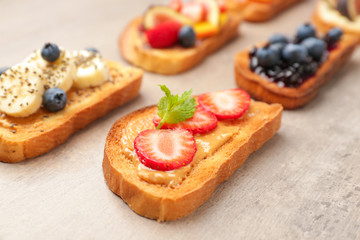 Different tasty sandwiches on grey background