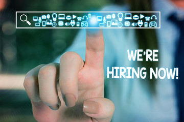 Text sign showing We Re Hiring Now. Business photo text recently employ someone or pay someone to do particular job Woman wear formal work suit presenting presentation using smart device