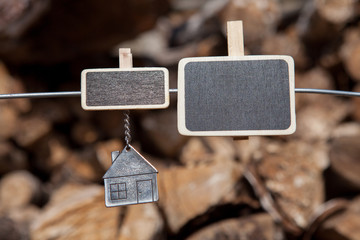 On the wire pinned a plate with a pendant in the shape of a house