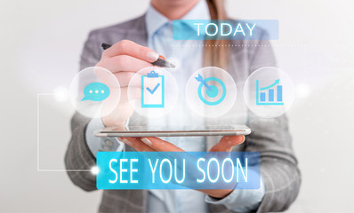 Handwriting text See You Soon. Conceptual photo used for saying goodbye to someone and going to meet again soon Female human wear formal work suit presenting presentation use smart device