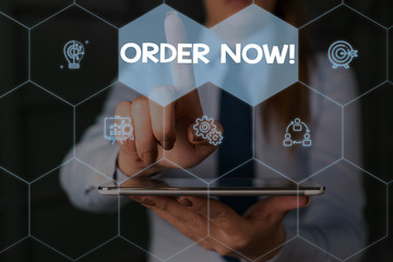 Writing note showing Order Now. Business concept for confirmed request by one party to another to...